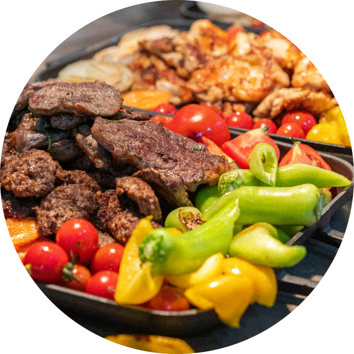 Mixed grilled meats with vibrant vegetables