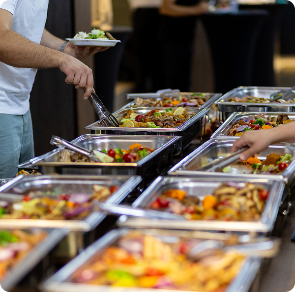 People serving themselves at buffet