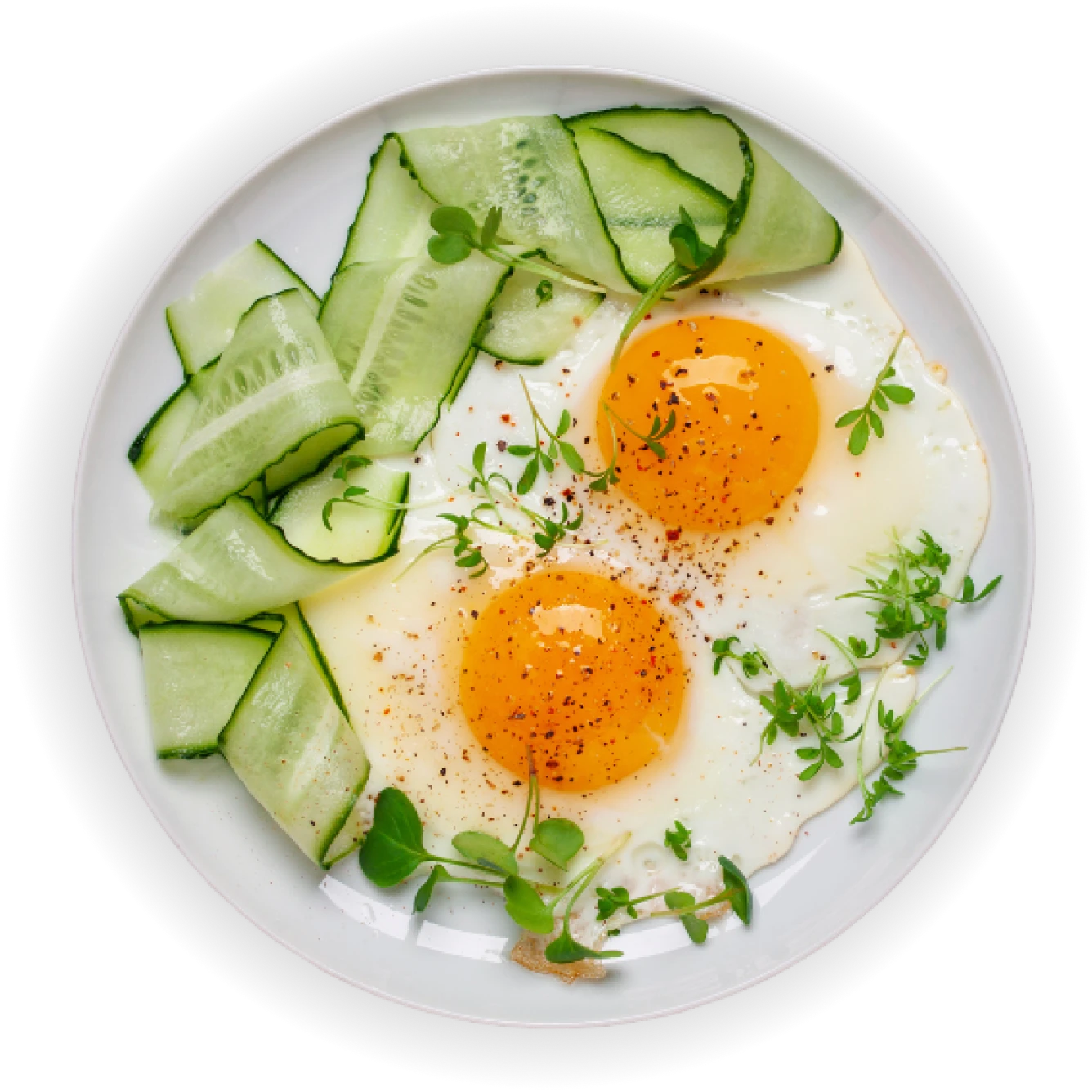 Sunny-side eggs and fresh cucumbers